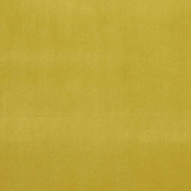 Close-up of Alvar Lime’s muted yellow-green fabric with a softly textured surface