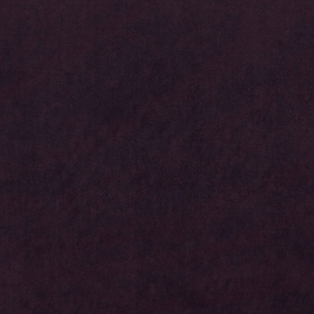 Close-up of deep mulberry plum fabric with subtle mottled shading and soft texture