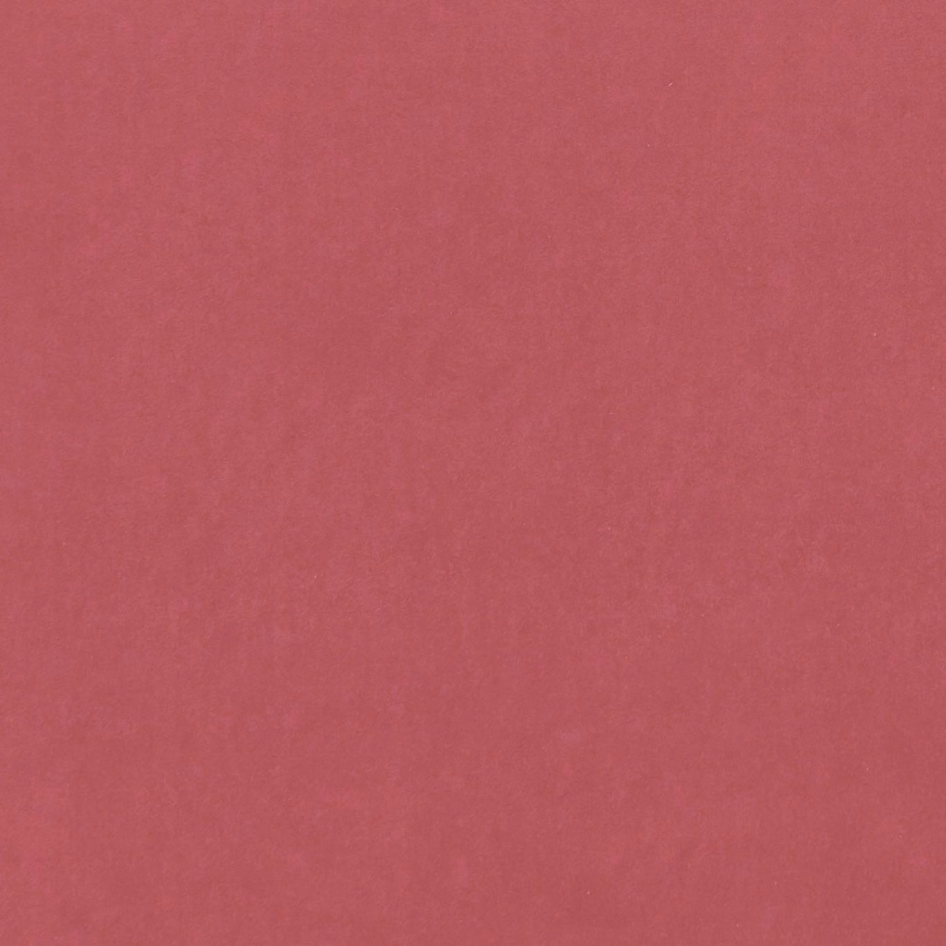 Close-up of plain muted peony pink fabric with a soft, fine texture