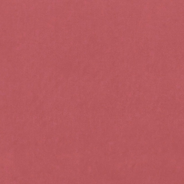Close-up of plain muted peony pink fabric with a soft, fine texture