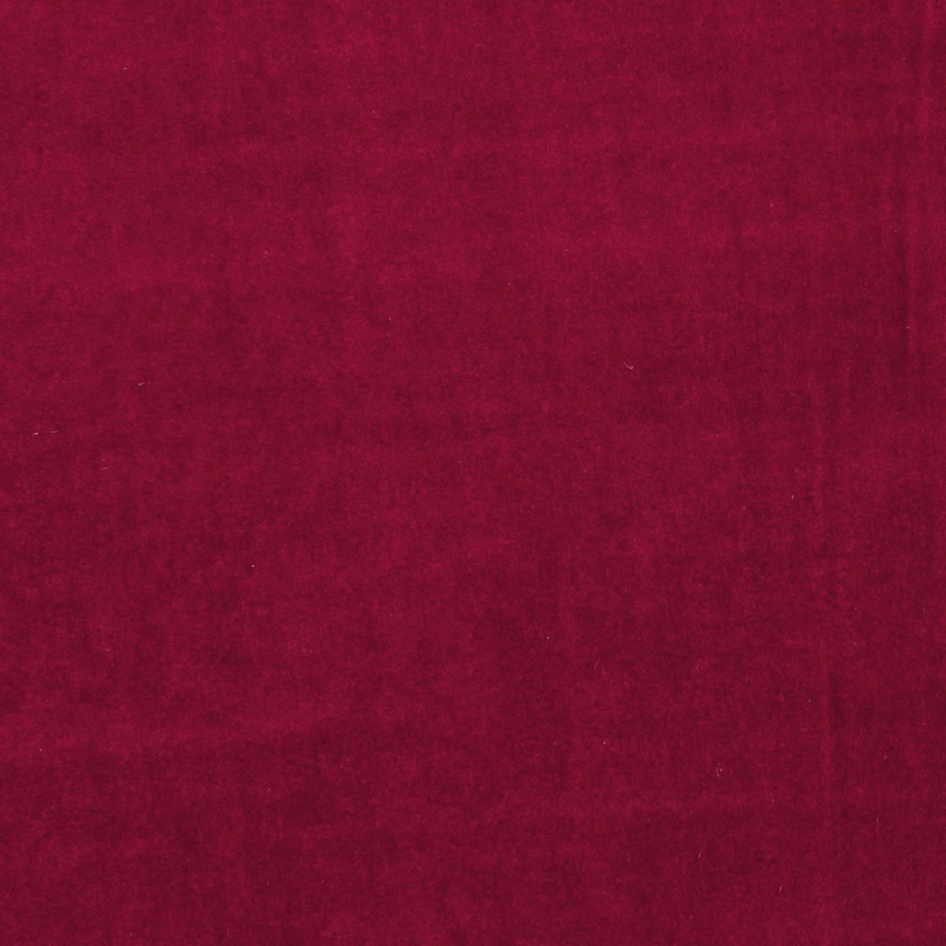 Deep raspberry red fabric with a softly brushed, subtly mottled surface