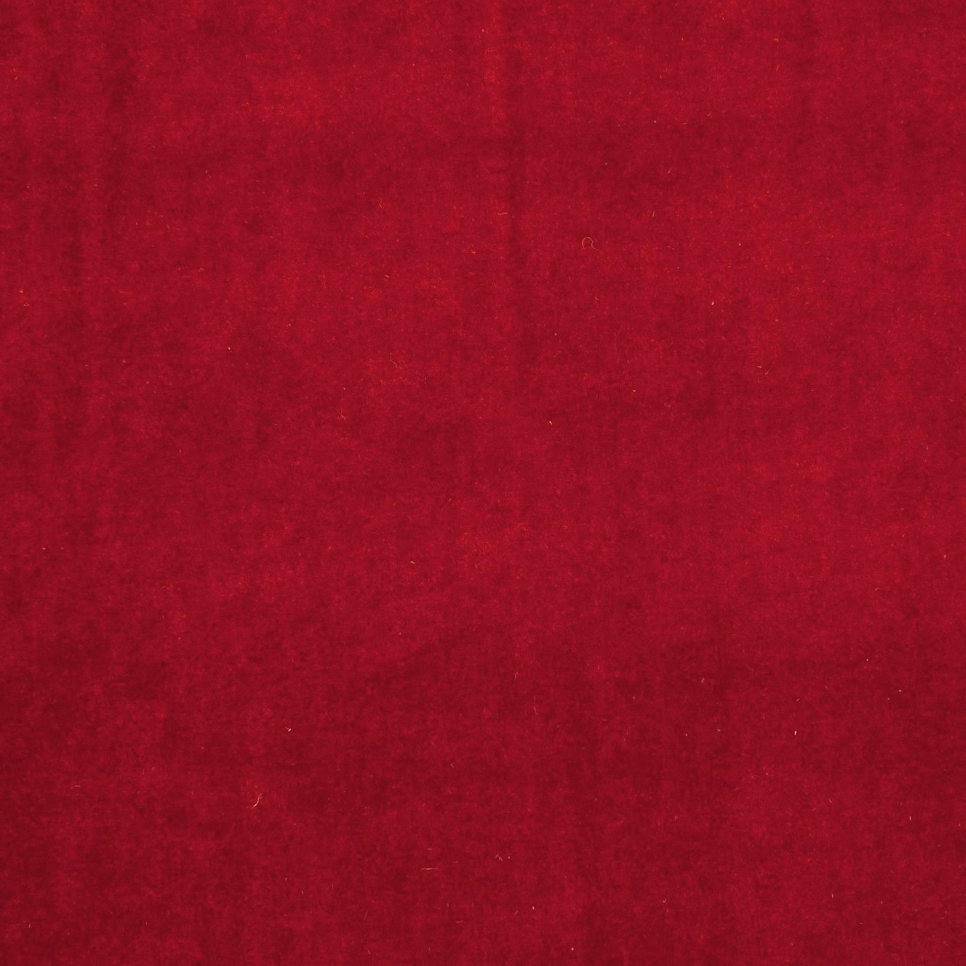 Deep ruby red fabric with a softly mottled, light-catching surface