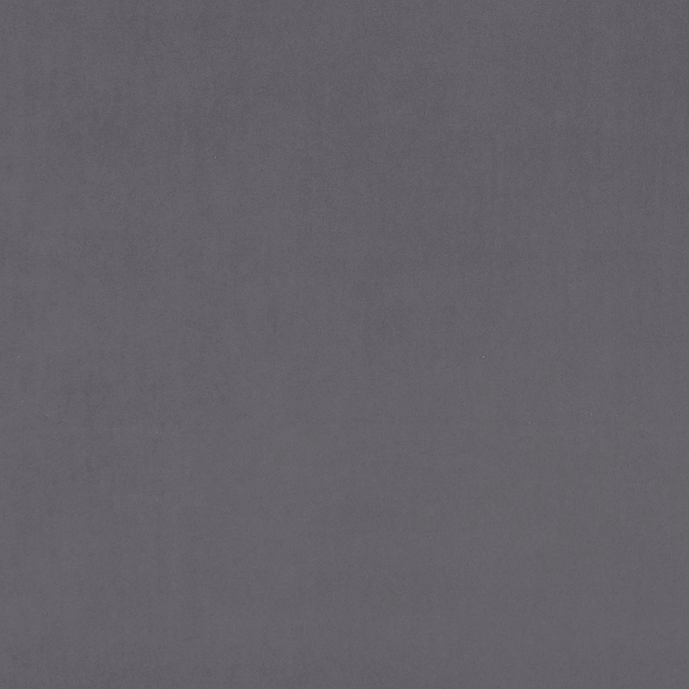 Close-up of plain charcoal-grey woven fabric with a subtle matte texture