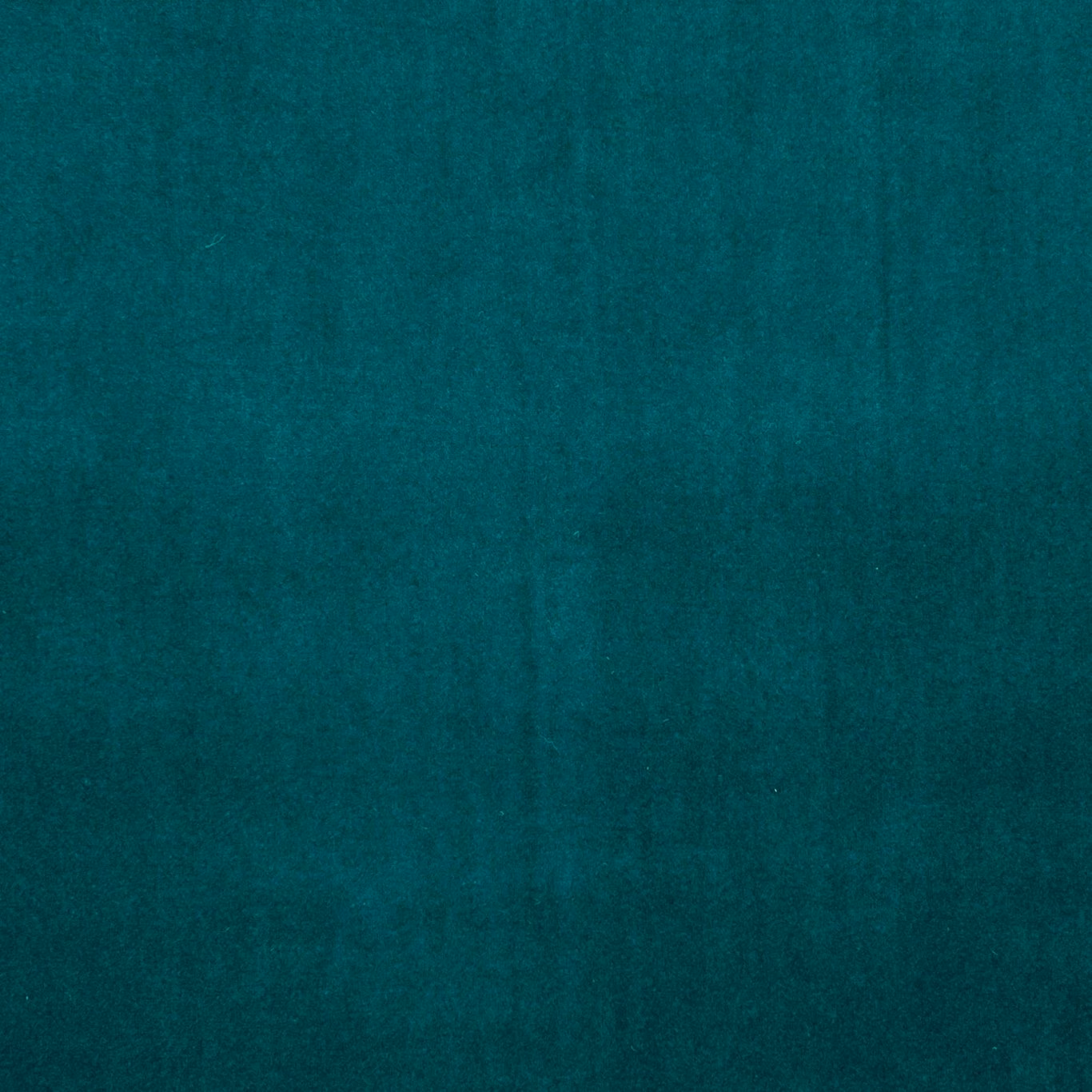Deep teal plain textile with softly mottled surface and subtle tonal shading