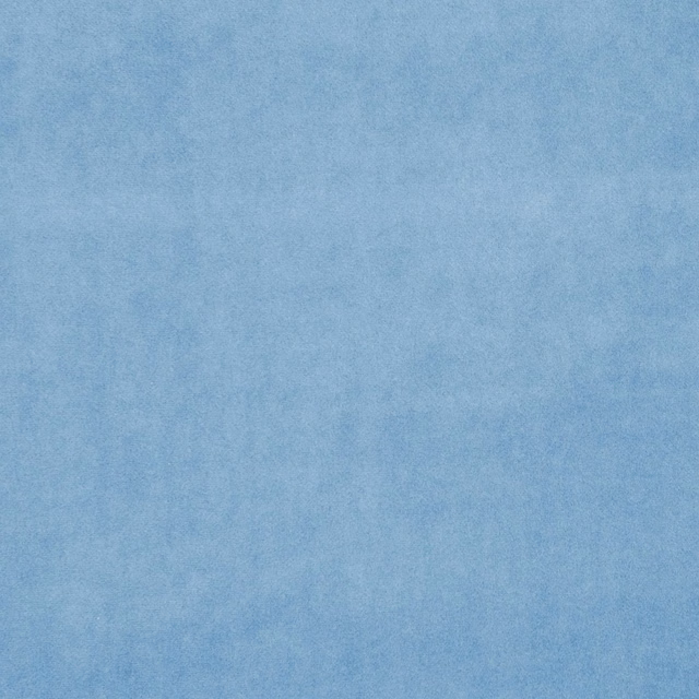Muted Wedgewood blue fabric with a softly cloudy, lightly textured plain surface