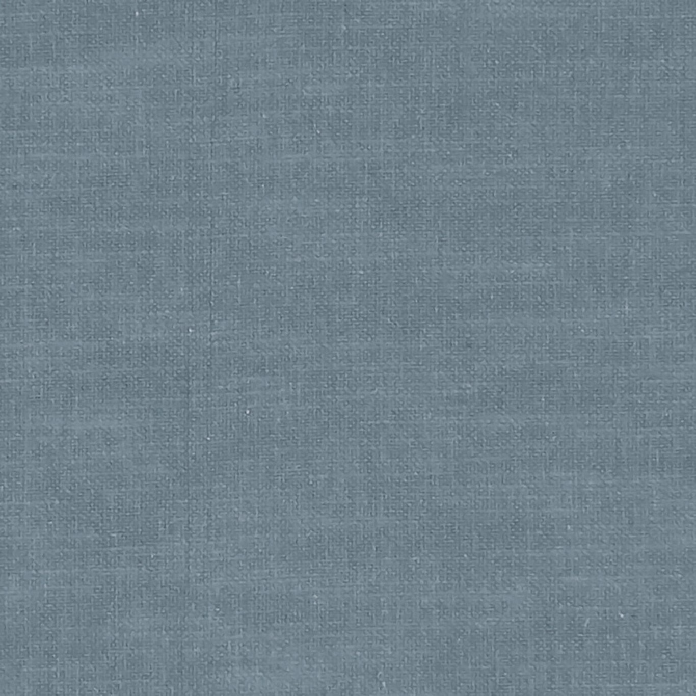 Close-up of muted slate-blue woven fabric with fine crosshatched texture
