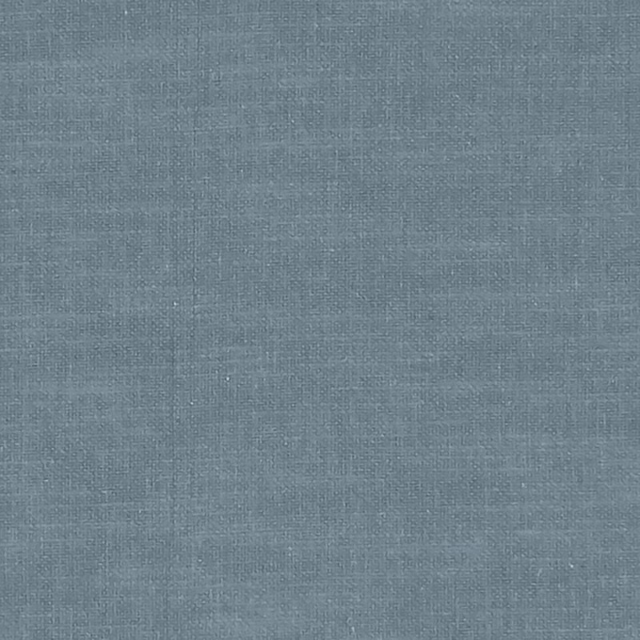 Close-up of muted slate-blue woven fabric with fine crosshatched texture