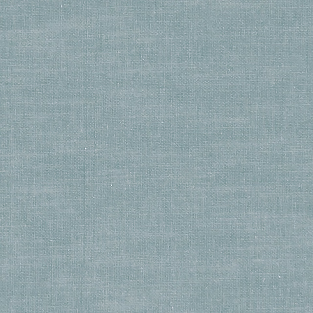 Close-up of cool denim-blue fabric with a fine crosshatched woven texture