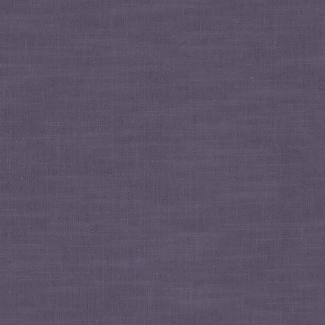 Close-up of dusky eggplant purple fabric with subtle crosshatch weave