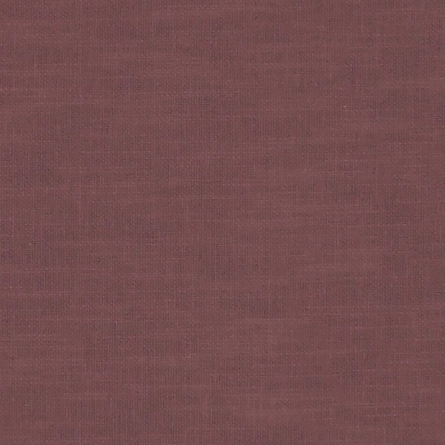 Close-up of muted plum grape fabric with a fine crosshatched woven texture