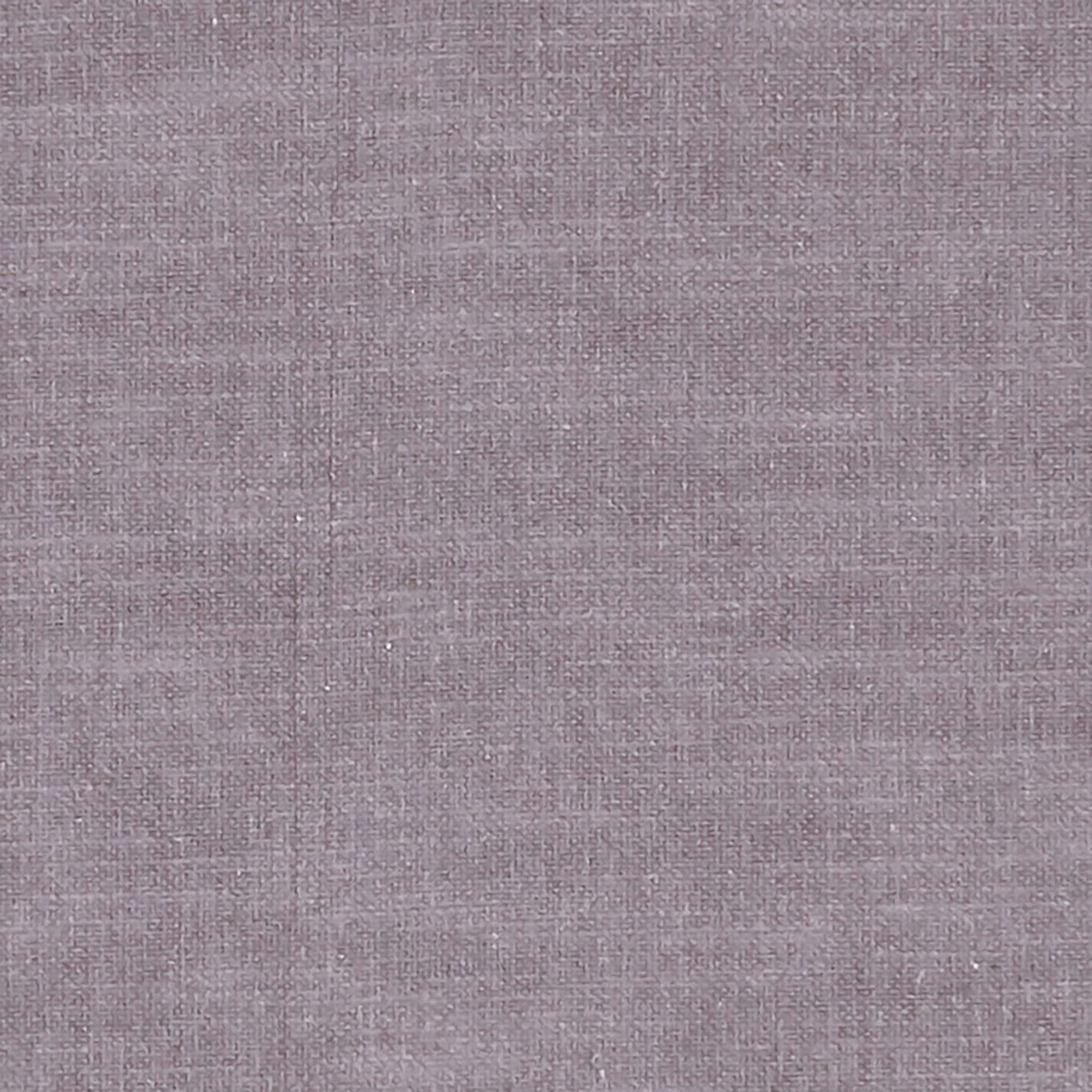 Close-up of dusty mauve woven fabric with fine crosshatched texture and subtle tonal variation
