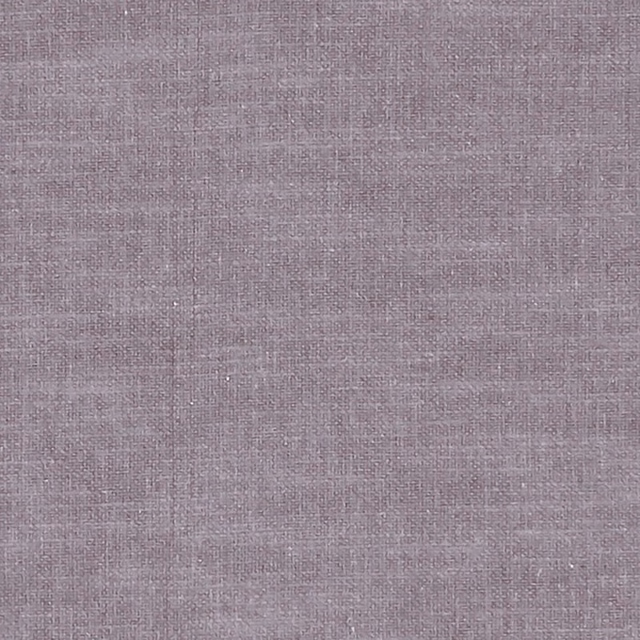 Close-up of dusty mauve woven fabric with fine crosshatched texture and subtle tonal variation