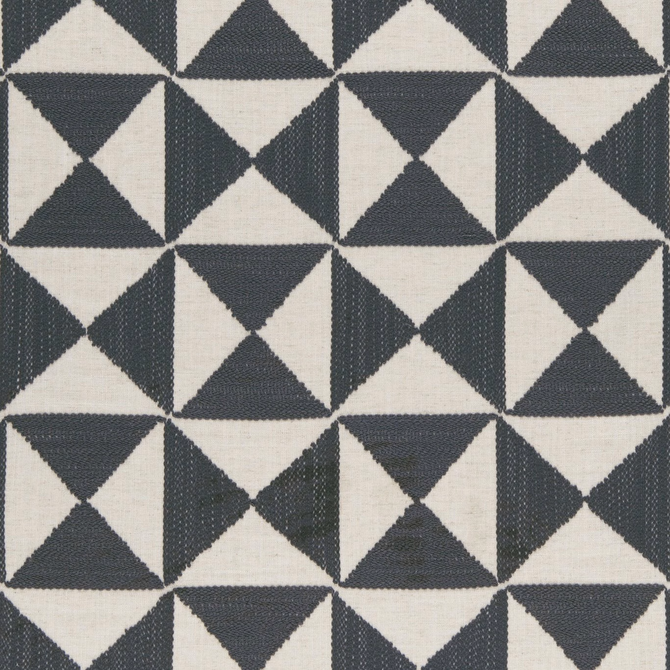 Charcoal and ivory woven triangles forming a crisp repeating geometric pattern