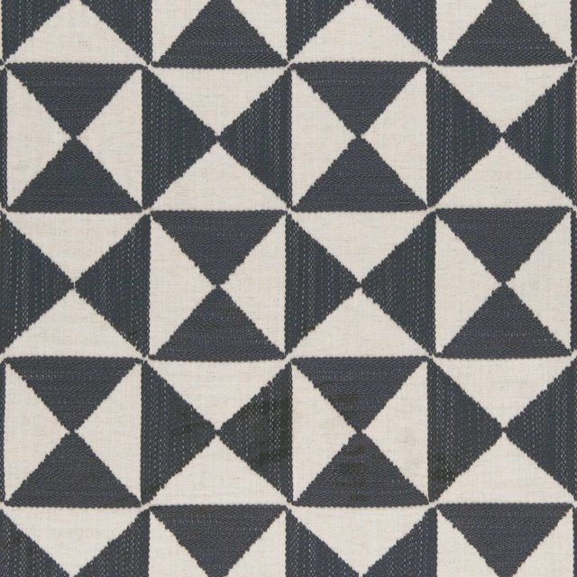 Charcoal and ivory woven triangles forming a crisp repeating geometric pattern