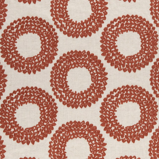 Ivory woven fabric with raised cinnabar-red interlocking ring motifs