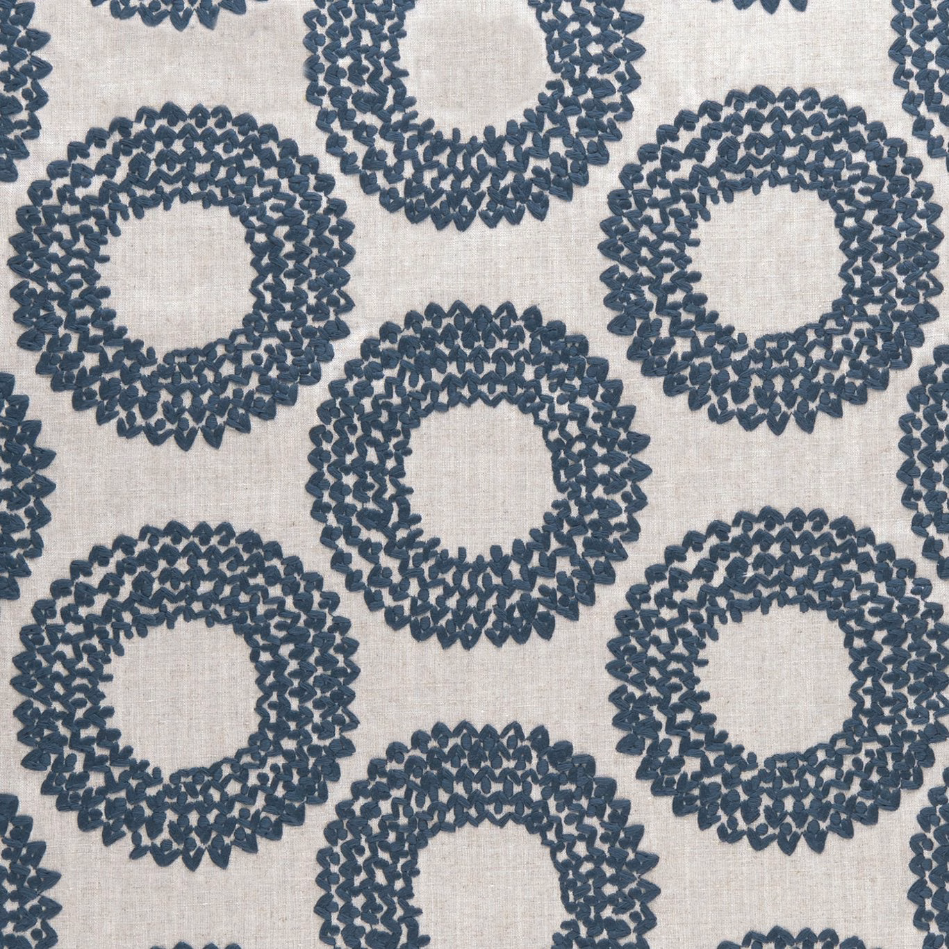 Cool indigo looped rings woven across a pale textured fabric ground