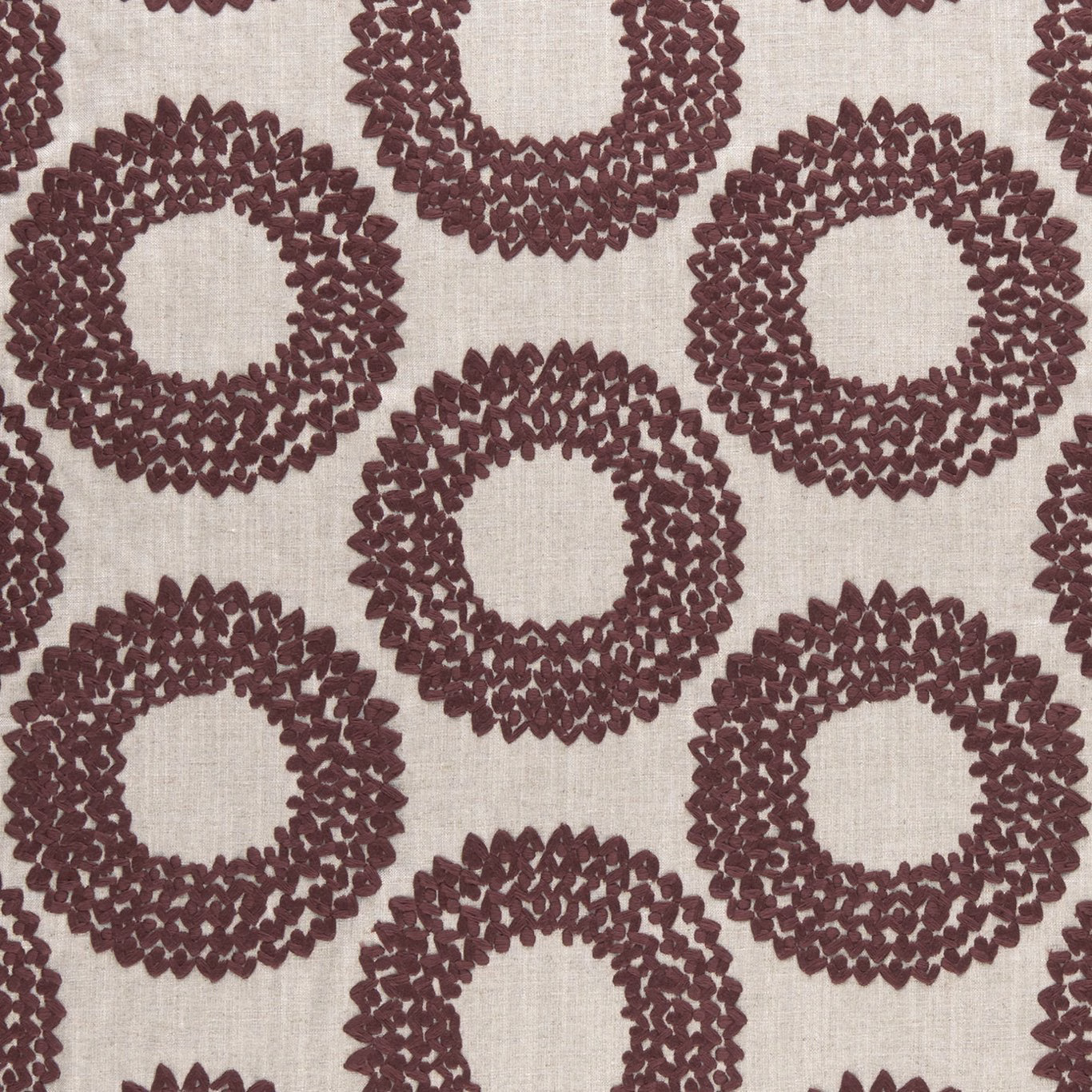 Muted plum textured ring motifs on a cream woven ground