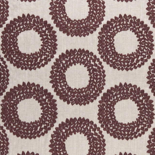 Muted plum textured ring motifs on a cream woven ground
