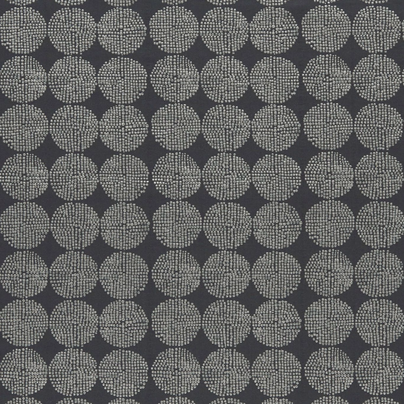 Deep charcoal fabric with pale dotted oval medallions and fine woven texture
