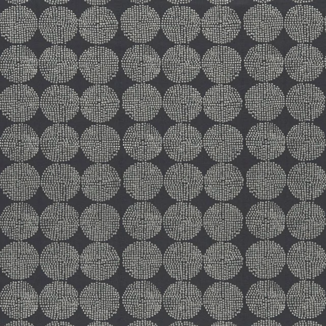 Deep charcoal fabric with pale dotted oval medallions and fine woven texture