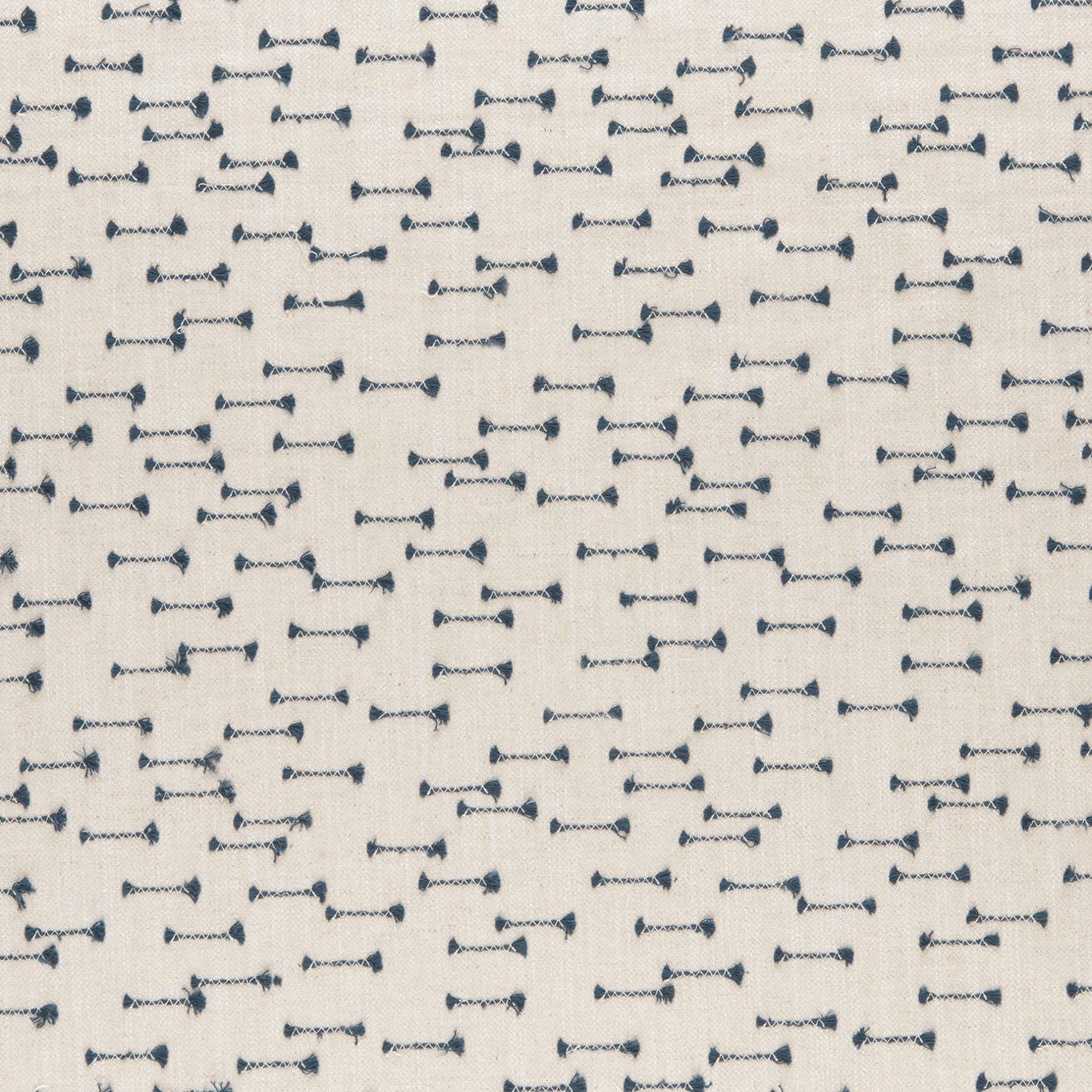 Cream woven ground with scattered small indigo bow-like motifs