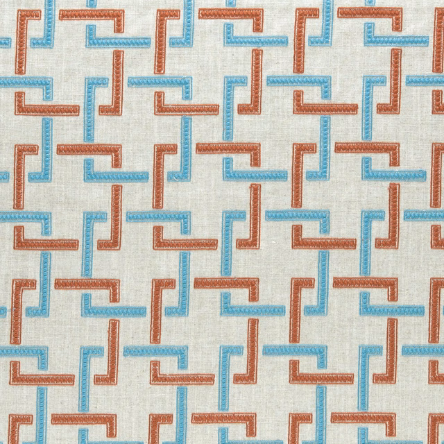 Cinnabar and aqua interlocking motifs woven across a pale cream ground