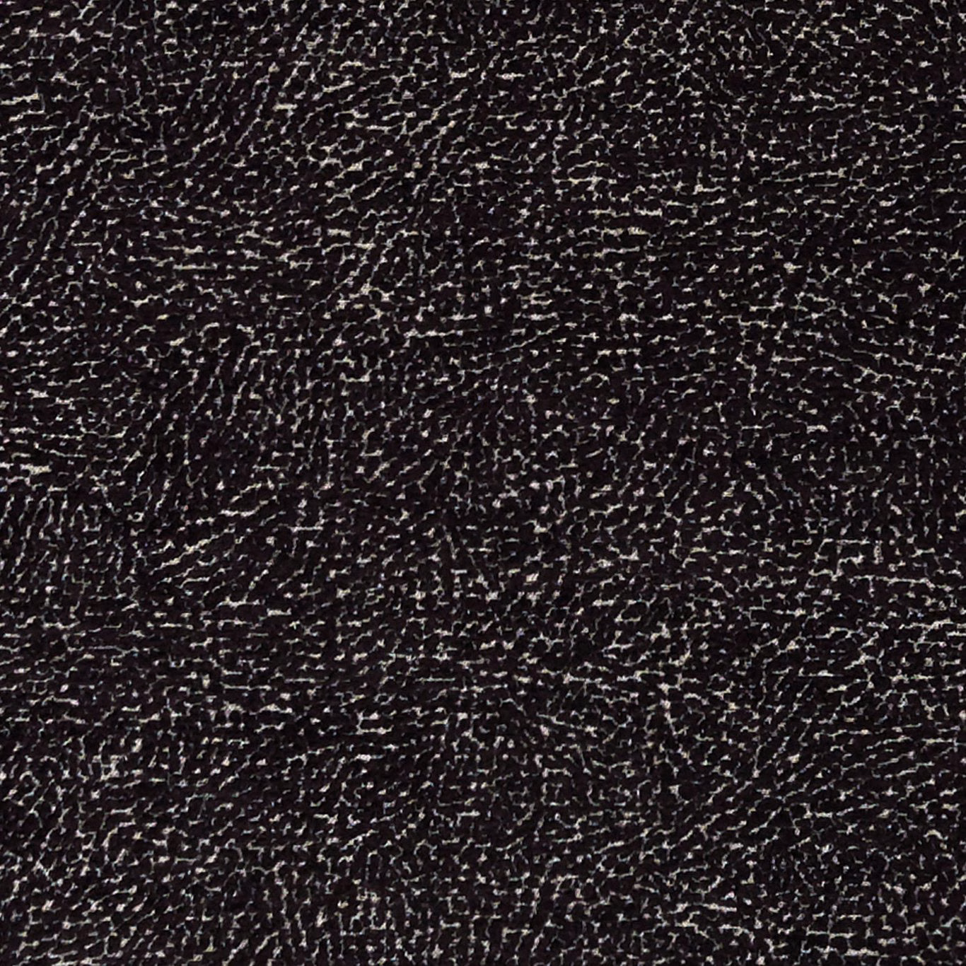 Black woven upholstery with dense ivory flecks and irregular rippled texture