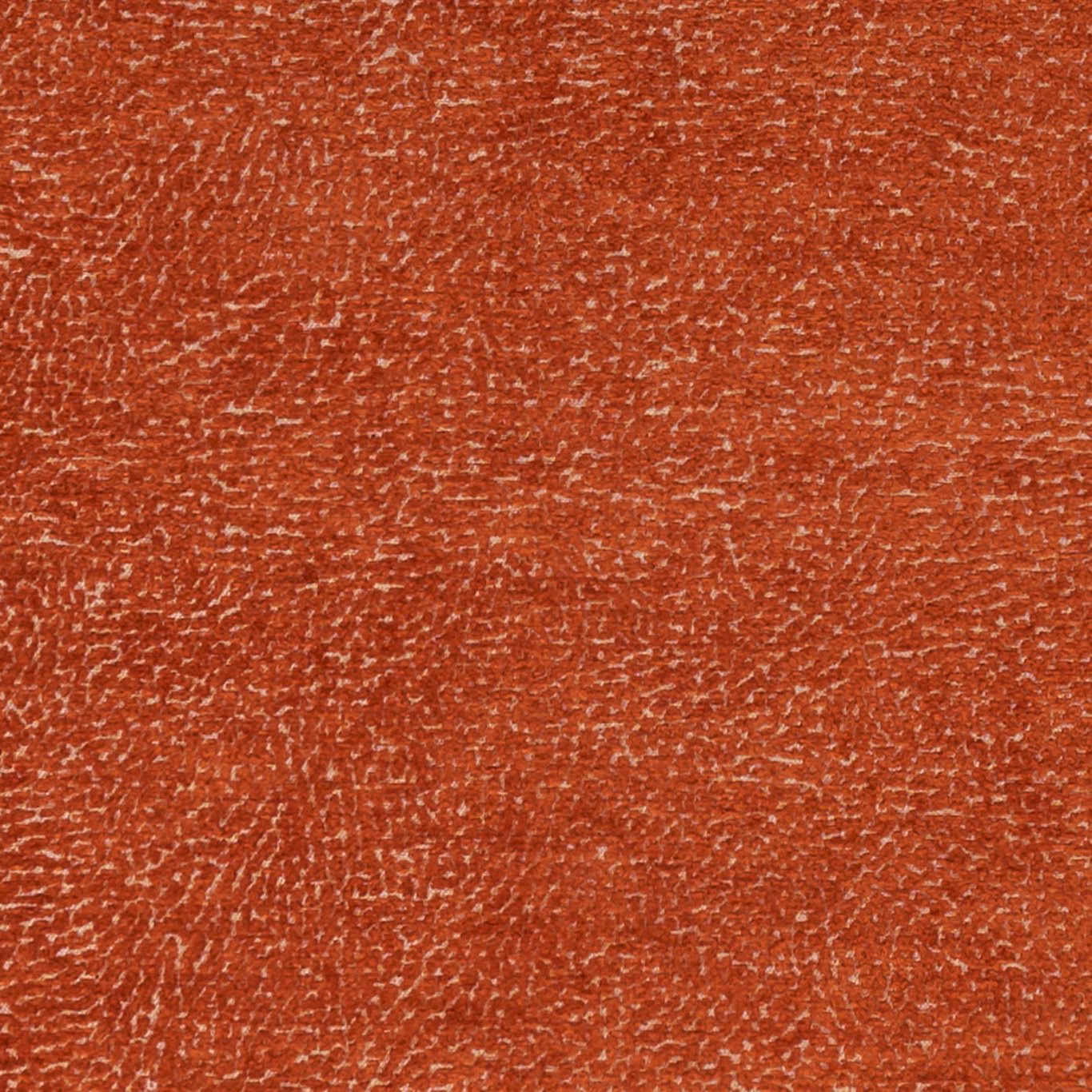 Close-up of warm spice terracotta fabric with irregular pale flecked woven texture