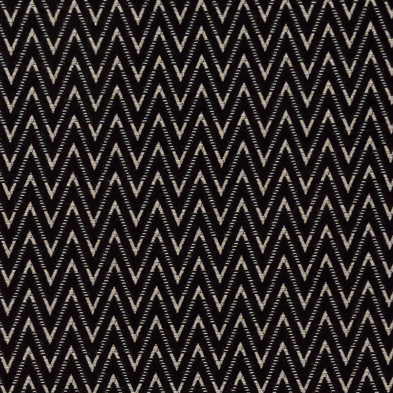 Black woven fabric with tightly spaced ivory-grey chevron zigzags and tactile texture