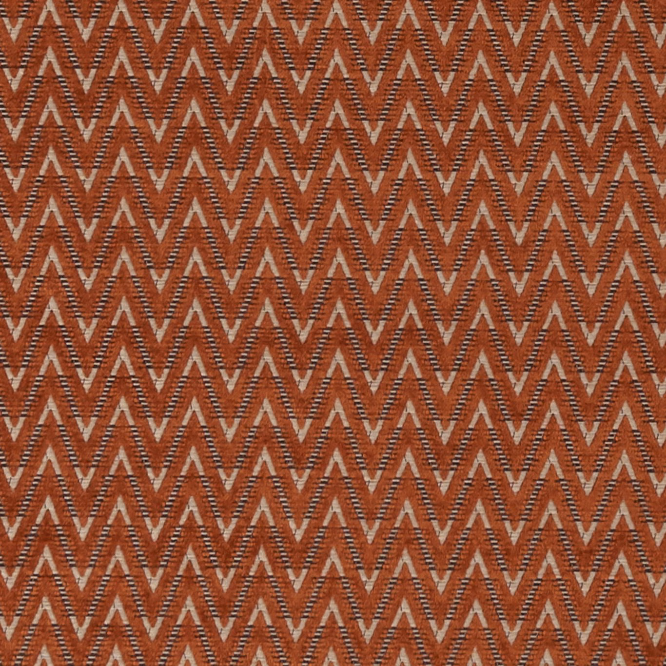 Rust terracotta woven upholstery with taupe zigzag chevrons and fine textured detailing