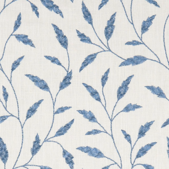 Muted denim-blue feathery branches on a cream, subtly woven fabric