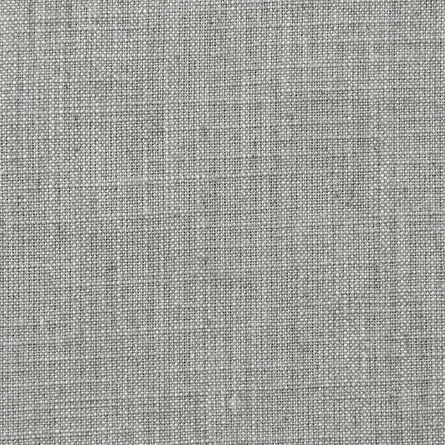 Close-up of cool slate-grey fabric with a fine mottled crosshatch weave