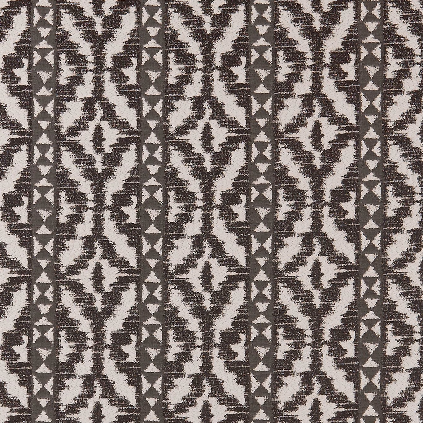 Charcoal black and white woven geometric fabric with distressed bands and diamond motifs
