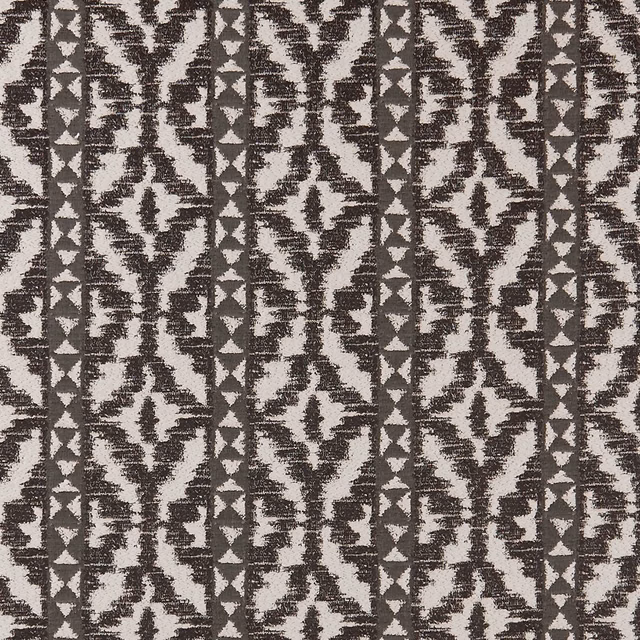 Charcoal black and white woven geometric fabric with distressed bands and diamond motifs