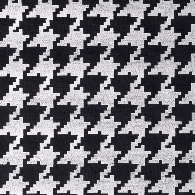 Close-up of black and white woven houndstooth with pixel-edged geometric motifs