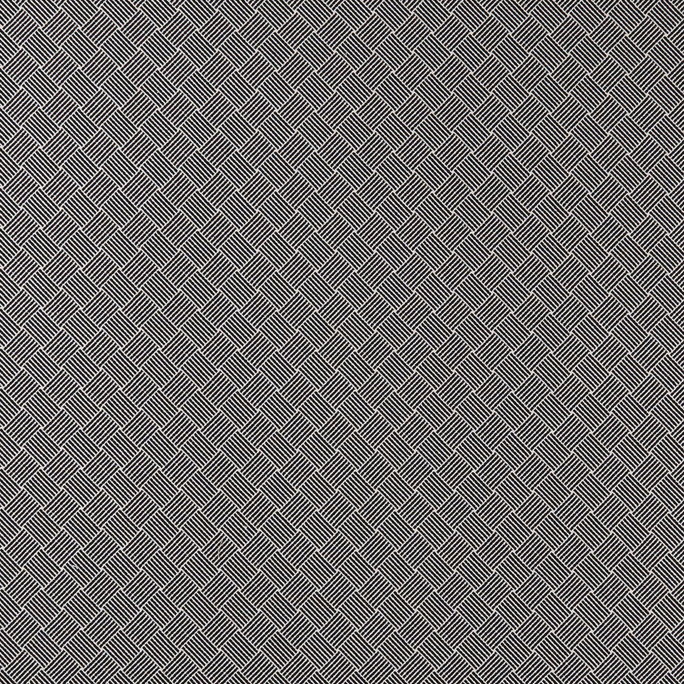 Close-up of black and white diagonal diamond lattice textile with fine linear texture