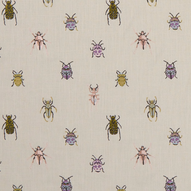 Cream woven fabric with scattered olive, pink and purple beetle motifs