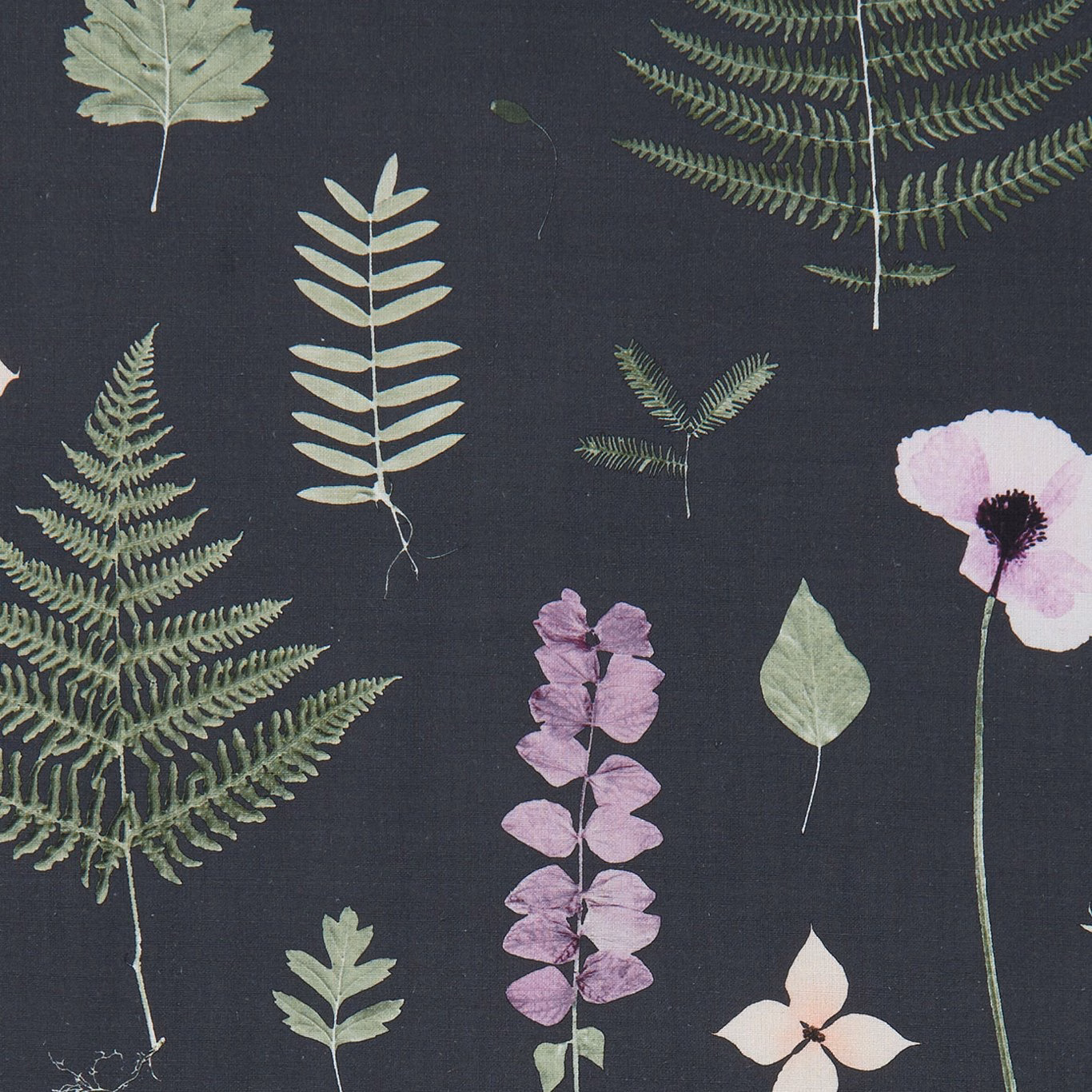 Charcoal botanical fabric with fern fronds, lilac flowers and pale green leaves