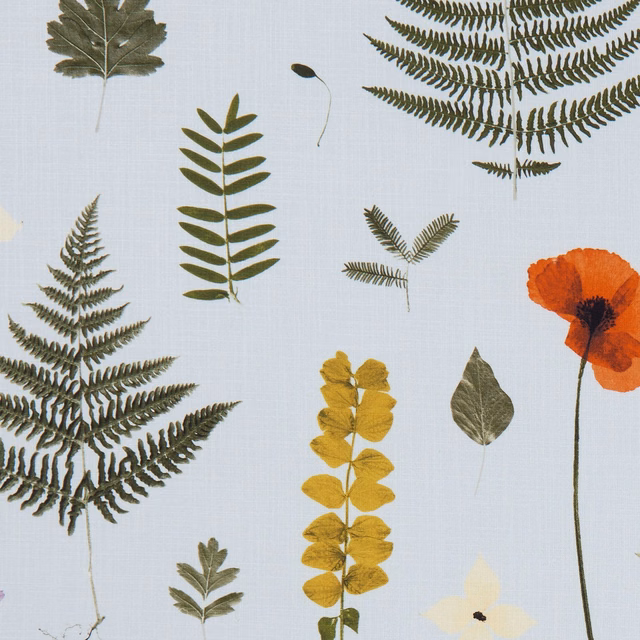 Pale mineral-blue botanical fabric with olive ferns, mustard leaves and rust poppy
