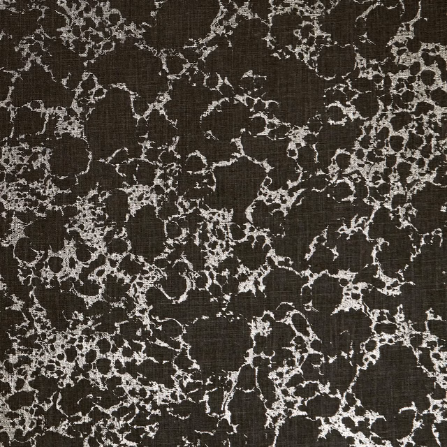 Charcoal woven ground with pale gold branching botanical tracery
