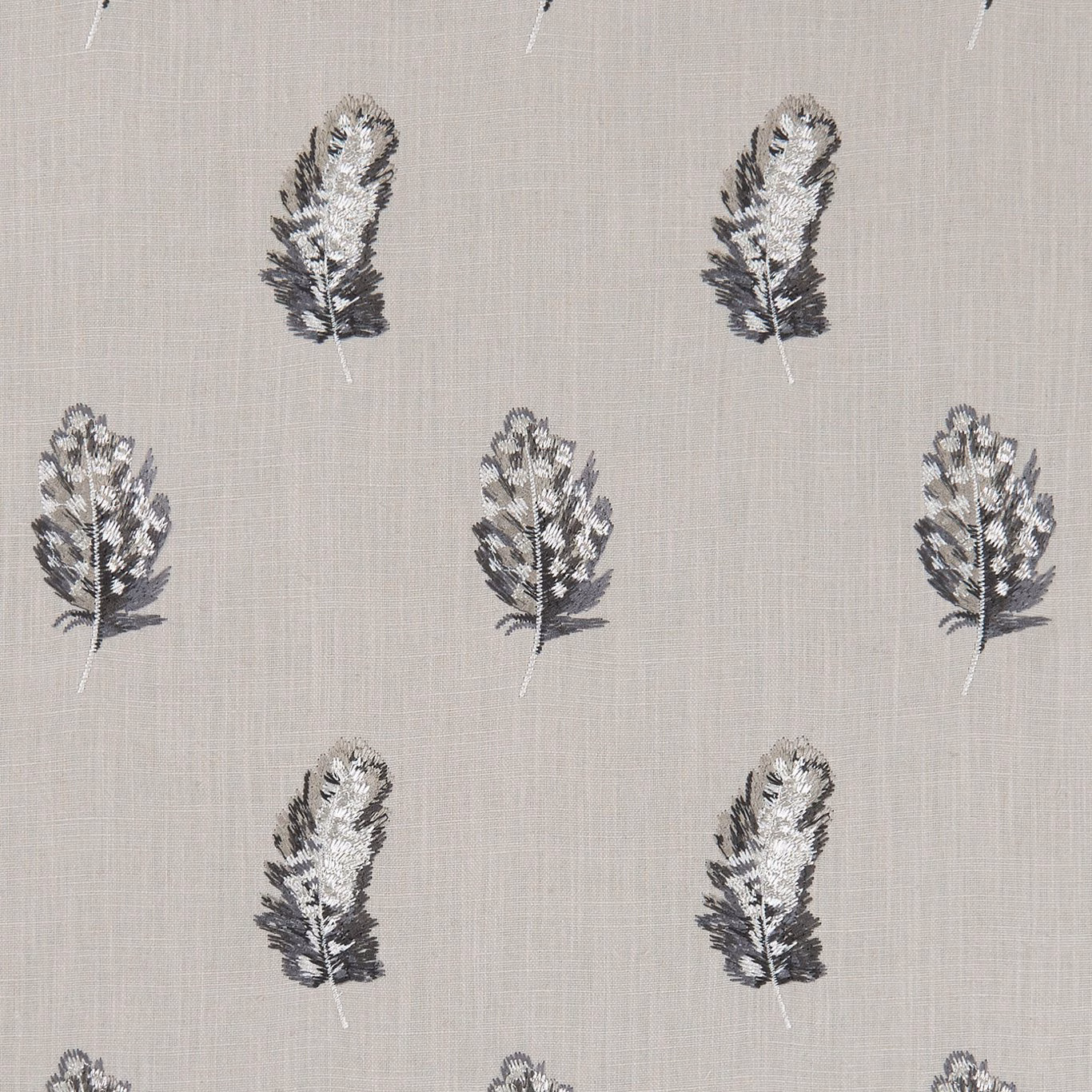 Charcoal botanical sprigs with ivory highlights on a textured linen-grey woven ground