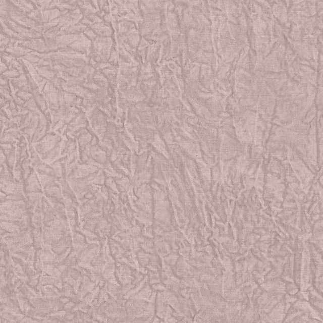 Dusty blush-pink textile with fine crinkled texture and softly shifting tonal surface
