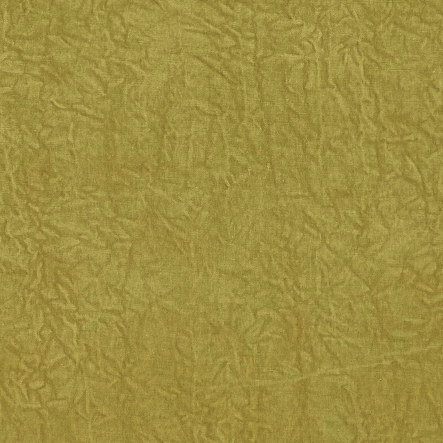 Muted chartreuse upholstery with crinkled tonal green texture across the swatch