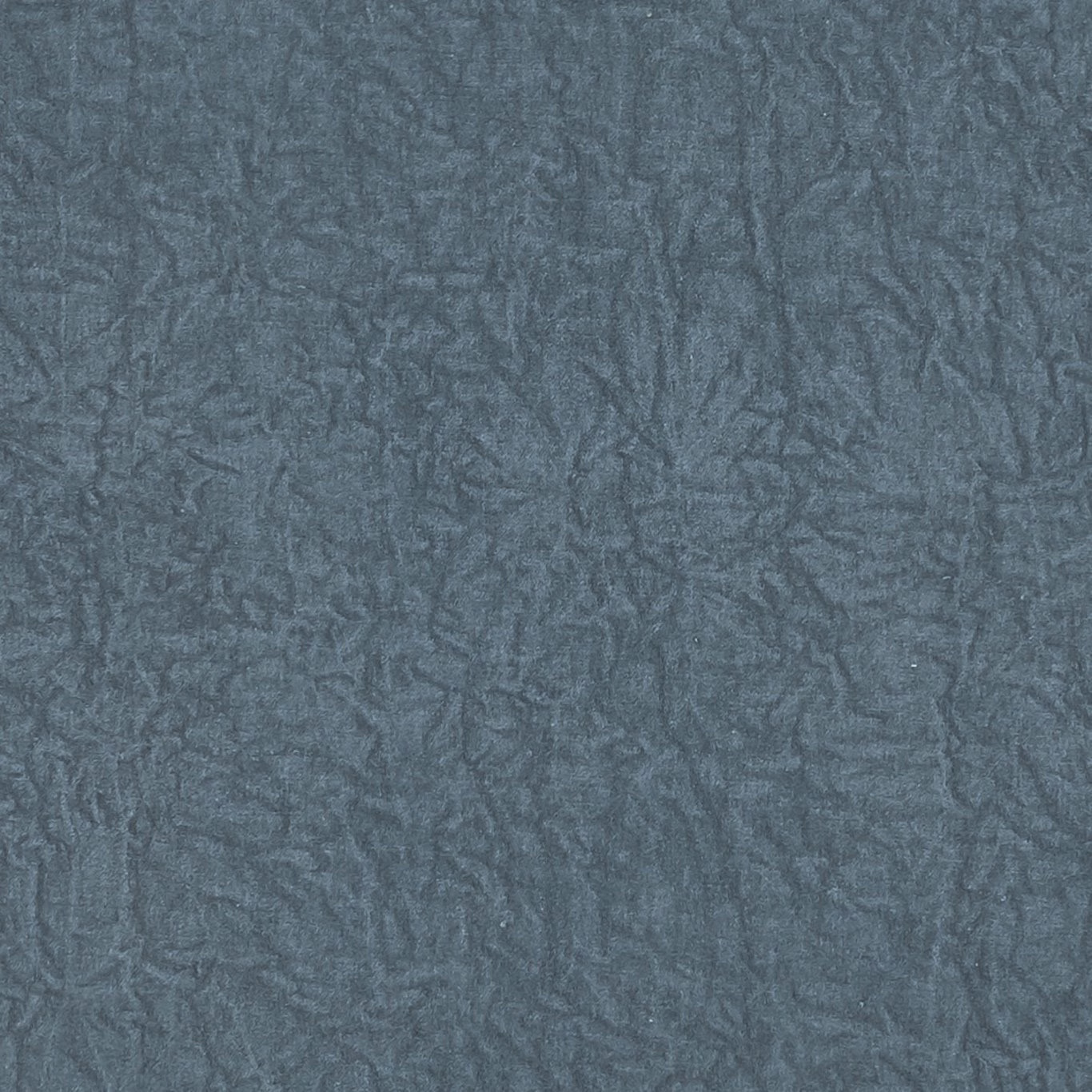 Close-up of Abelia Denim in muted denim blue with crinkled tonal texture