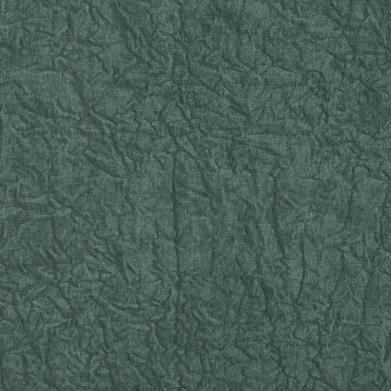 Deep emerald green fabric with smoky, crumpled leaf-like tonal texture