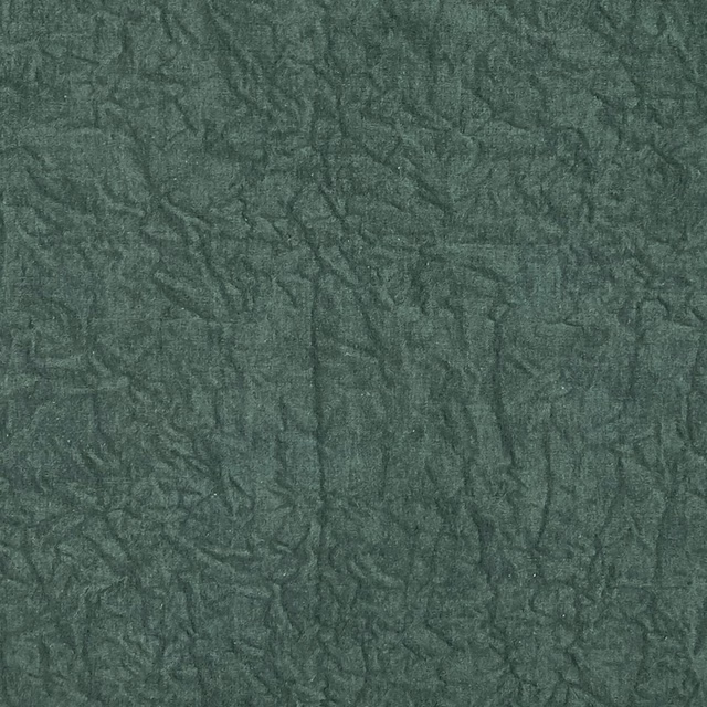 Deep emerald green fabric with smoky, crumpled leaf-like tonal texture