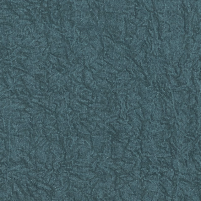 Deep peacock teal fabric with dense irregular crinkled texture and subtle blue-green highlights