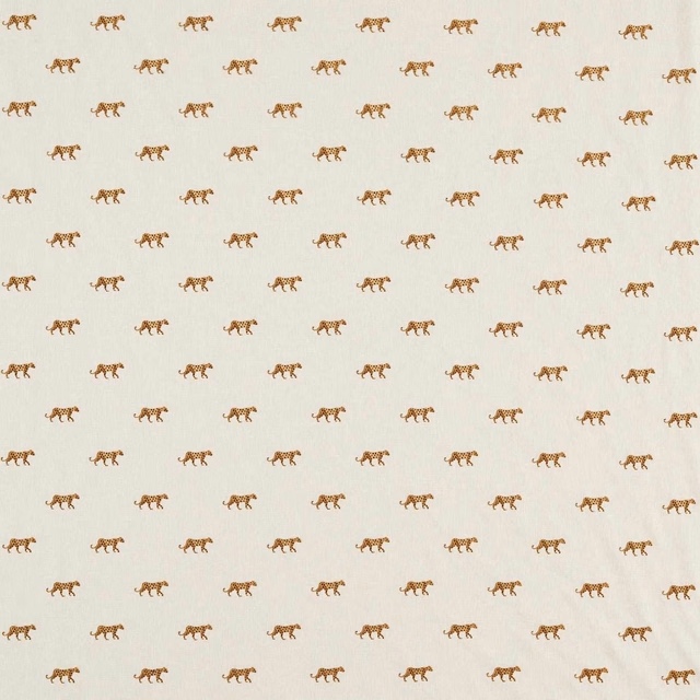 Warm ivory fabric with evenly spaced small ochre-brown tiger motifs