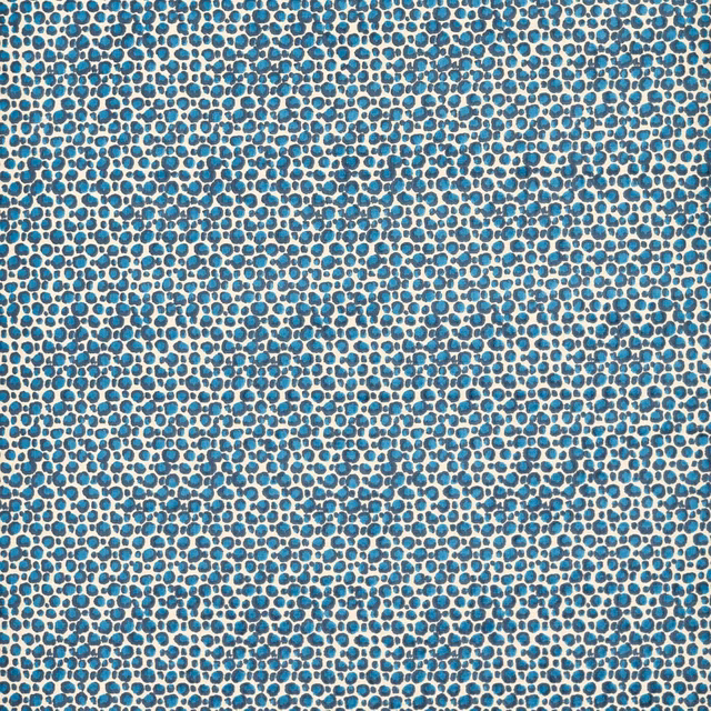 Turquoise and navy pebble motif woven across a warm ivory ground