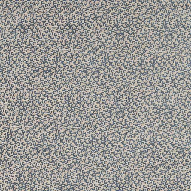 Dense muted denim-blue loop motif woven across a warm stone ground